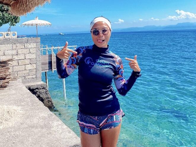 Ivon standing in front of the Coral Restoration site in Nusa Penida, Bali