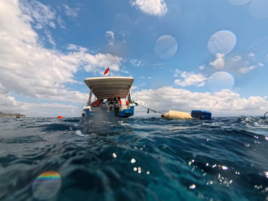 Boats anchoring near the coral restoration site in Nusa Penida, Indonesia