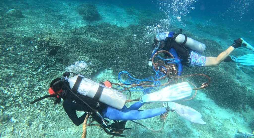 Our team removing the mooring buoy after repeated interference.