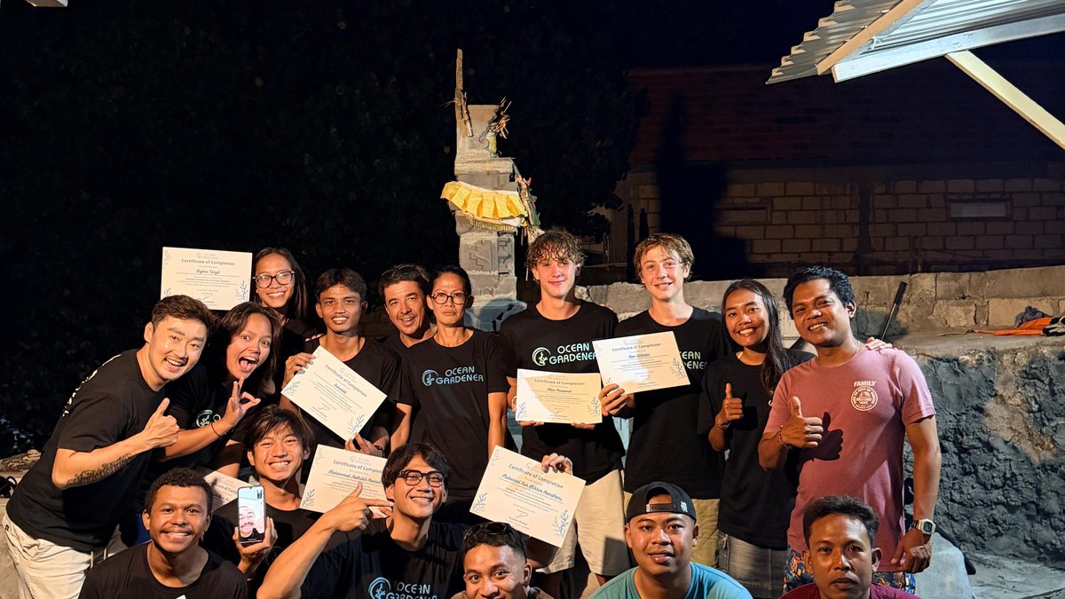 Coral Restoration Course Batch 8 participants and instructors holding their certificates of completion at Ocean Gardener